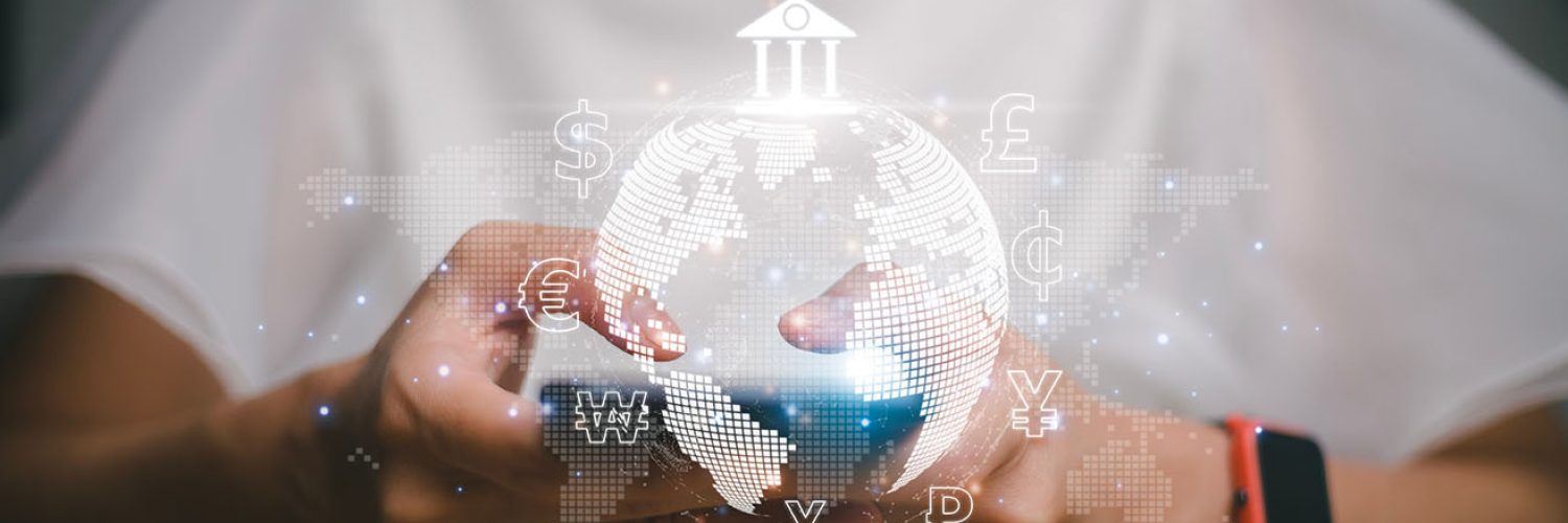 A person holding a digital representation of the globe with various financial and currency symbols,